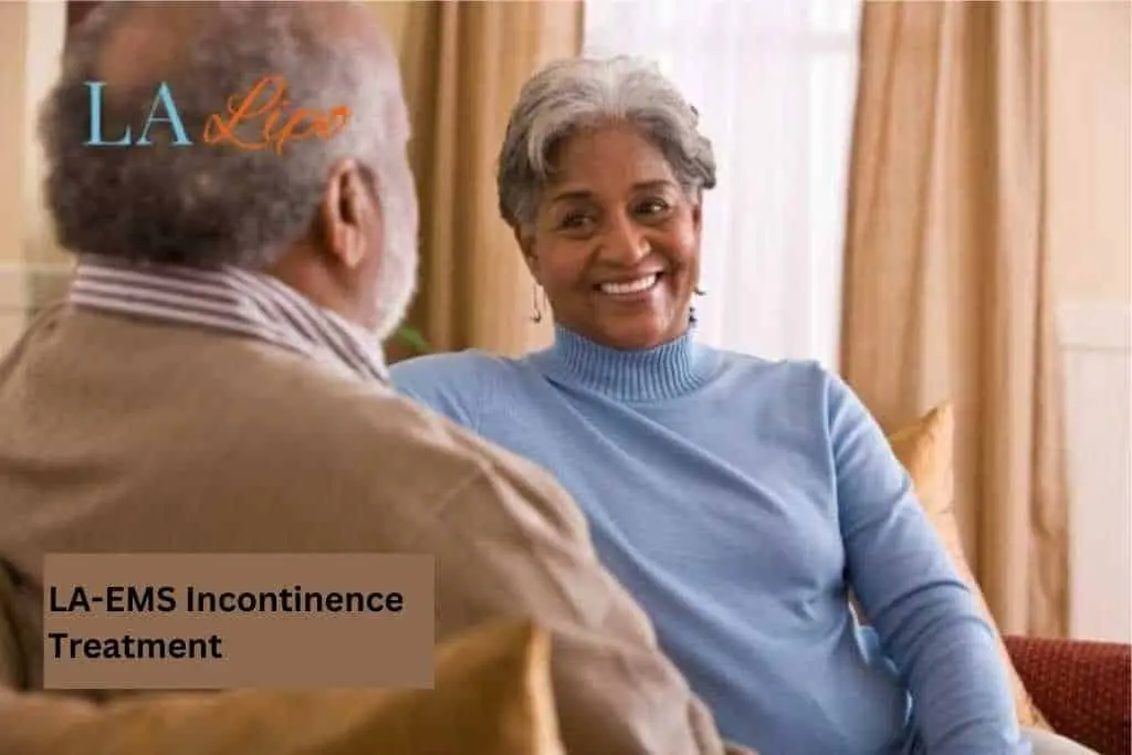 Couple sat smiling at each other - LA-EMS treatment Elstree